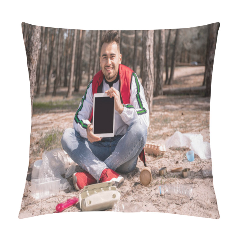 Personality  Happy Man With Crossed Legs Sitting And Holding Digital Tablet With Blank Screen Near Trash On Ground Pillow Covers