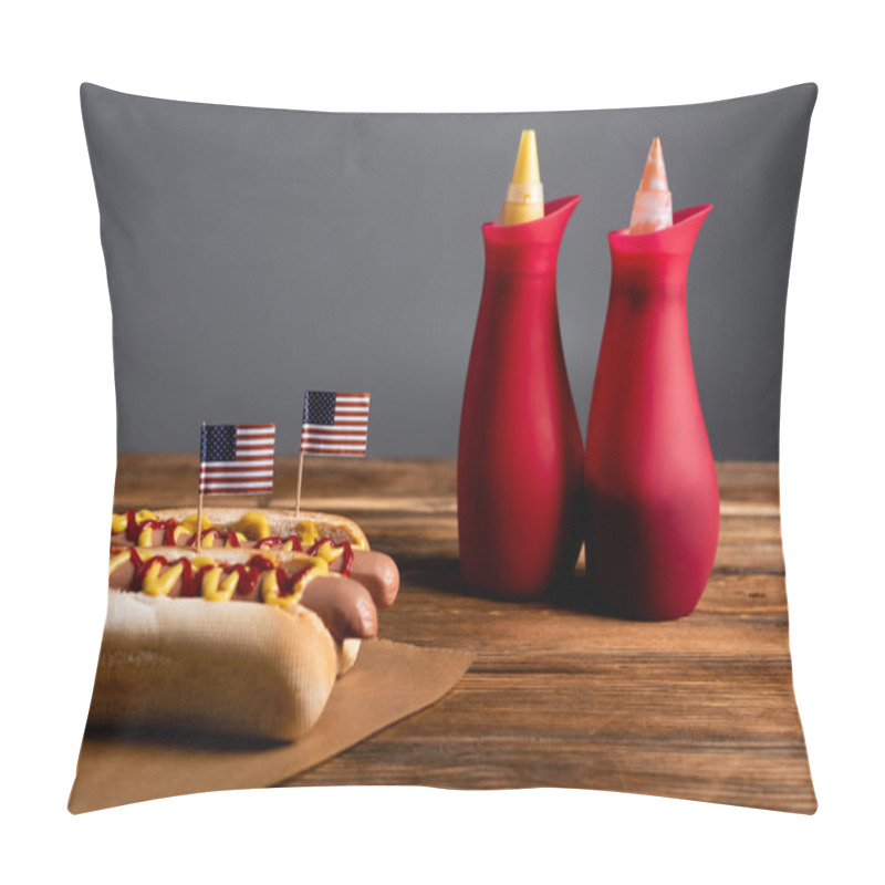 Personality  Souse Bottles Near Hot Dogs With Small American Flags On Wooden Table Isolated On Grey Pillow Covers