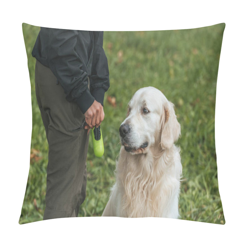 Personality  Cropped Shot Of Woman Holding Bag For Cleaning After Pet In Park Pillow Covers