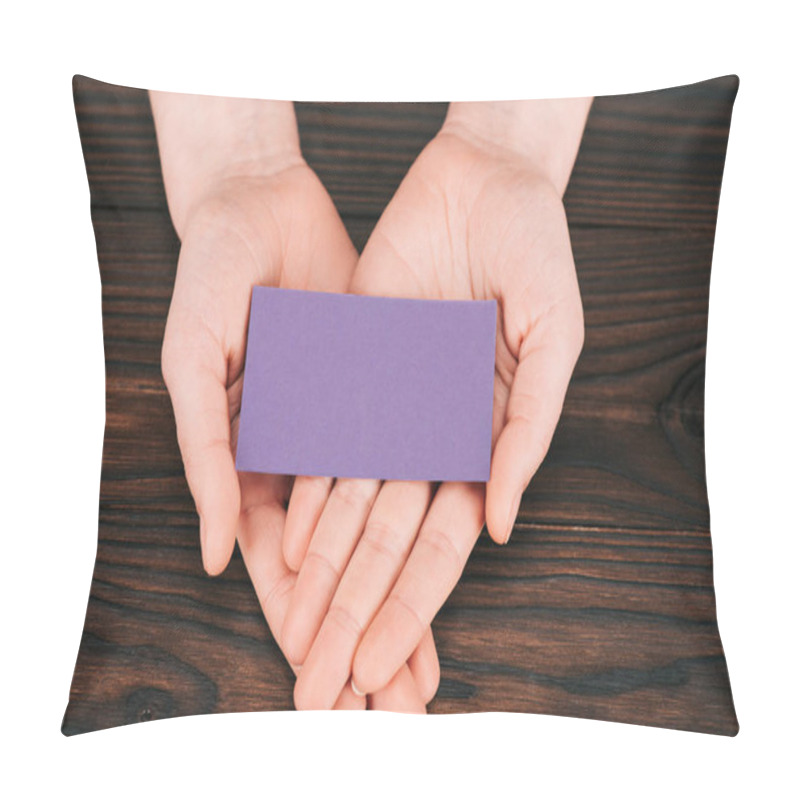 Personality  Cropped Shot Of Woman Holding Blank Purple Paper Over Wooden Table Pillow Covers