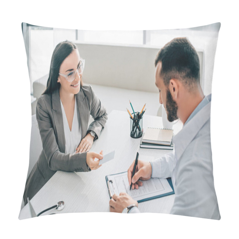 Personality  High Angle View Of Smiling Patient Giving Id Card To Doctor To Fill Insurance Claim Form In Hospital Pillow Covers