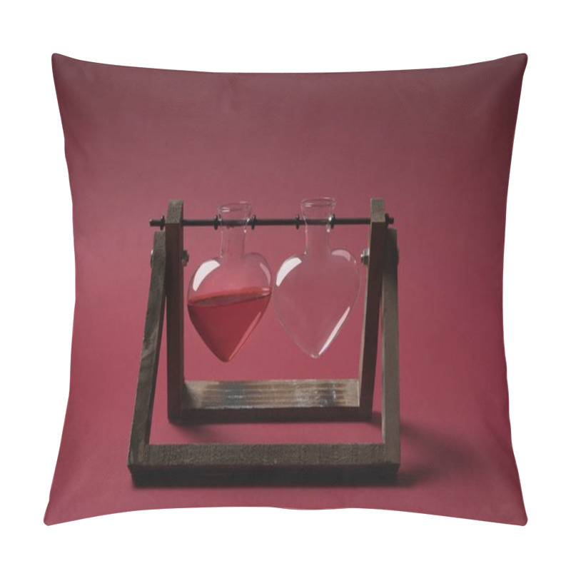 Personality  Heart Shaped Glass Jar With Perfume And Empty Glass Jar On Wooden Stand On Red Pillow Covers