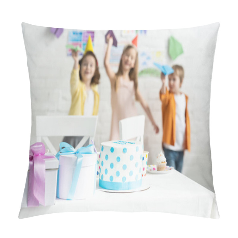 Personality  Selective Focus Of Cake And Presents On Table And Kids Playing With Paper Planes During Birthday Party  Pillow Covers