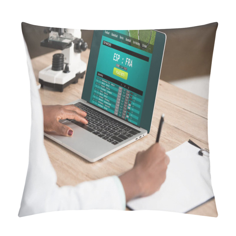 Personality  Cropped View Of African American Doctor Using Laptop With Sports Bet Website Near Microscope Pillow Covers