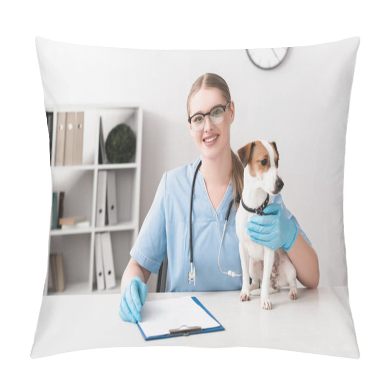 Personality  Happy Veterinarian In Blue Latex Gloves Looking At Camera Near Jack Russell Terrier On Table Pillow Covers