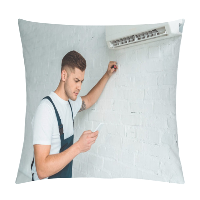 Personality  Handsome Installer Using Smartphone Near Air Conditioner  Pillow Covers