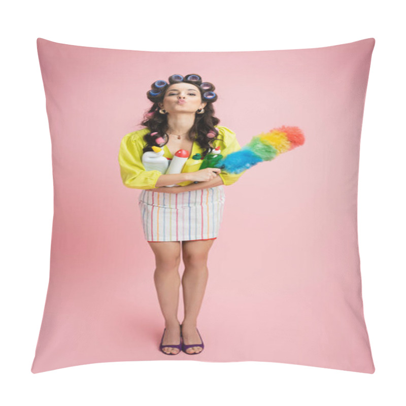 Personality  Full Length Of Flirty Housewife In Hair Curlers Holding Dust Brush And Detergents While Pouting Lips On Pink Background Pillow Covers