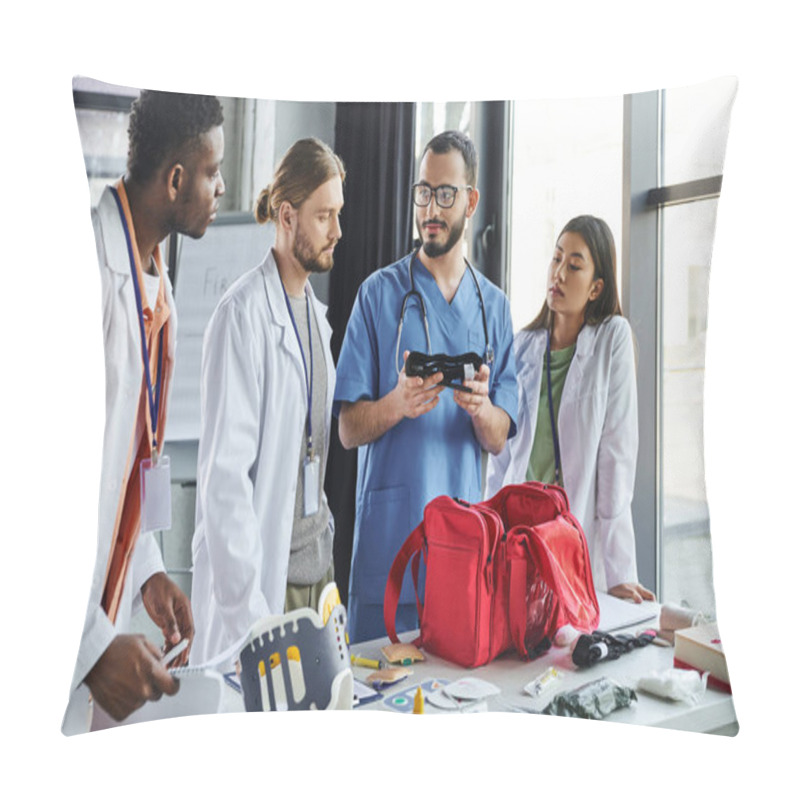 Personality  Healthcare Worker In Uniform Showing Compressive Tourniquet To Diverse Group Of Interracial Students Near Medical Equipment In Training Room, Life-saving Skills And Bleeding Prevention Concept Pillow Covers