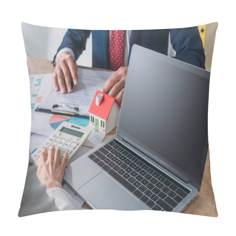 Personality  Cropped Shot Of Man Studying Loan Agreement And Businesswoman Using Calculator While Sitting At Workplace With Near Laptop, House Model, Graphs And Charts Pillow Covers