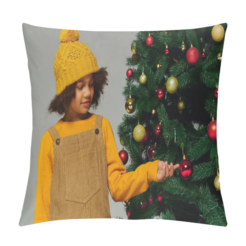 Personality  Young Girl In Yellow Sweater And Hat Adds Ornaments To A Festive Christmas Tree In December 2025 Pillow Covers