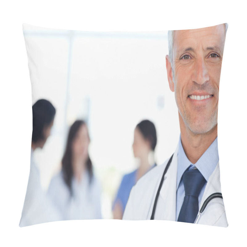 Personality  Smiling Doctor With His Medical Interns Behind Him Pillow Covers