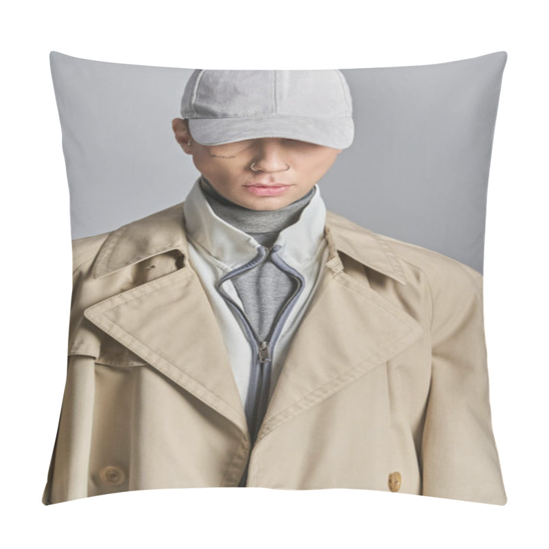 Personality  A Young, Tattooed Man In A Trench Coat And Hat Stands Confidently In A Studio Against A Grey Background. Pillow Covers