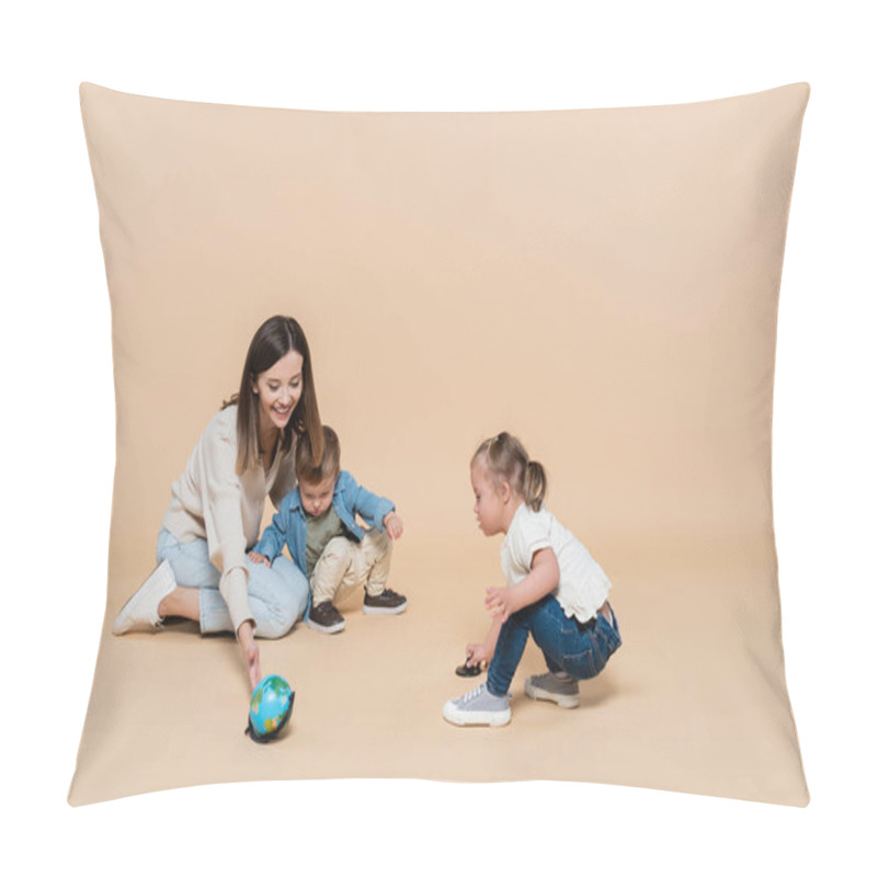 Personality  Happy Woman Playing With Globe Near Toddler Boy And Girl With Down Syndrome On Beige Pillow Covers