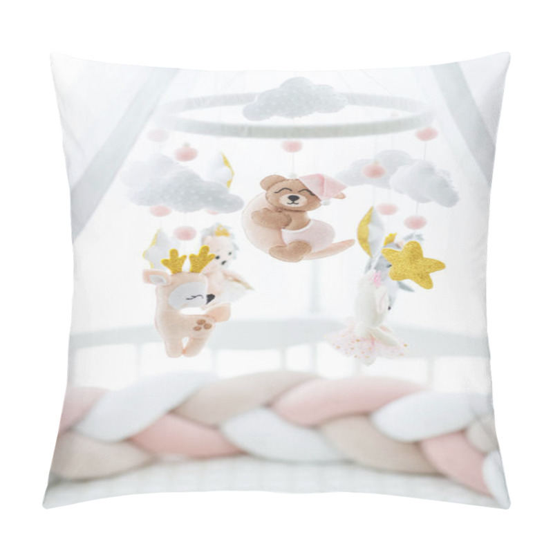 Personality  A Crib And A Toy Above It. A Delicate Toy Hangs Over The Childrens Bed. Pillow Covers