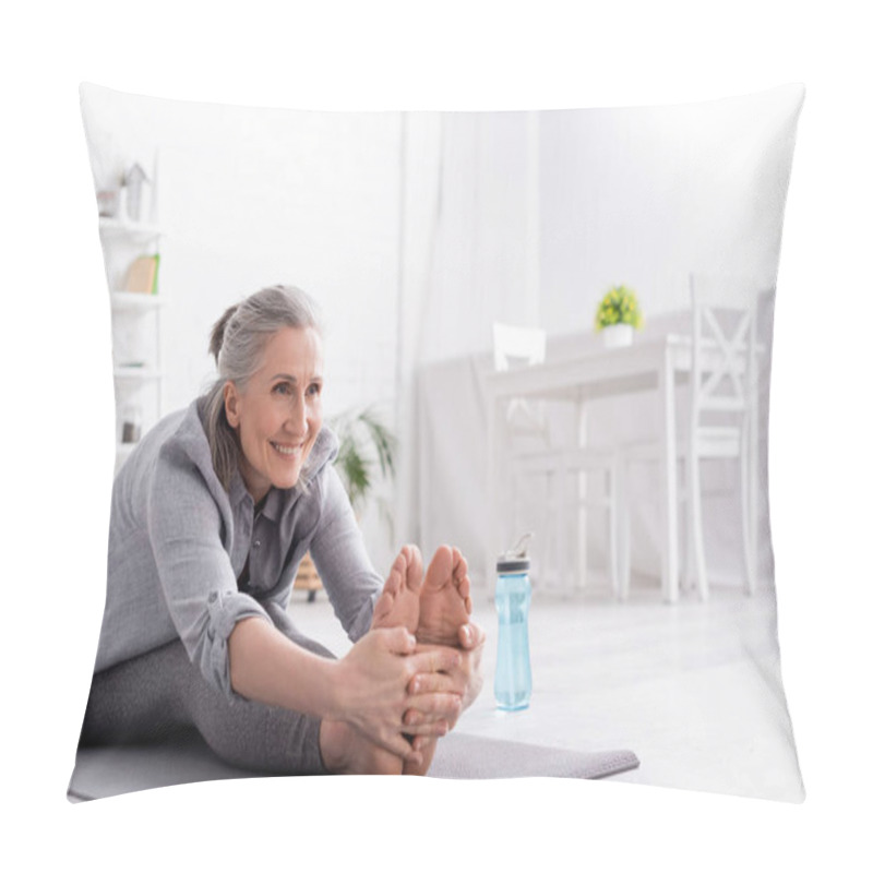 Personality  Cheerful Mature Woman With Grey Hair Stretching On Yoga Mat Near Sports Bottle  Pillow Covers