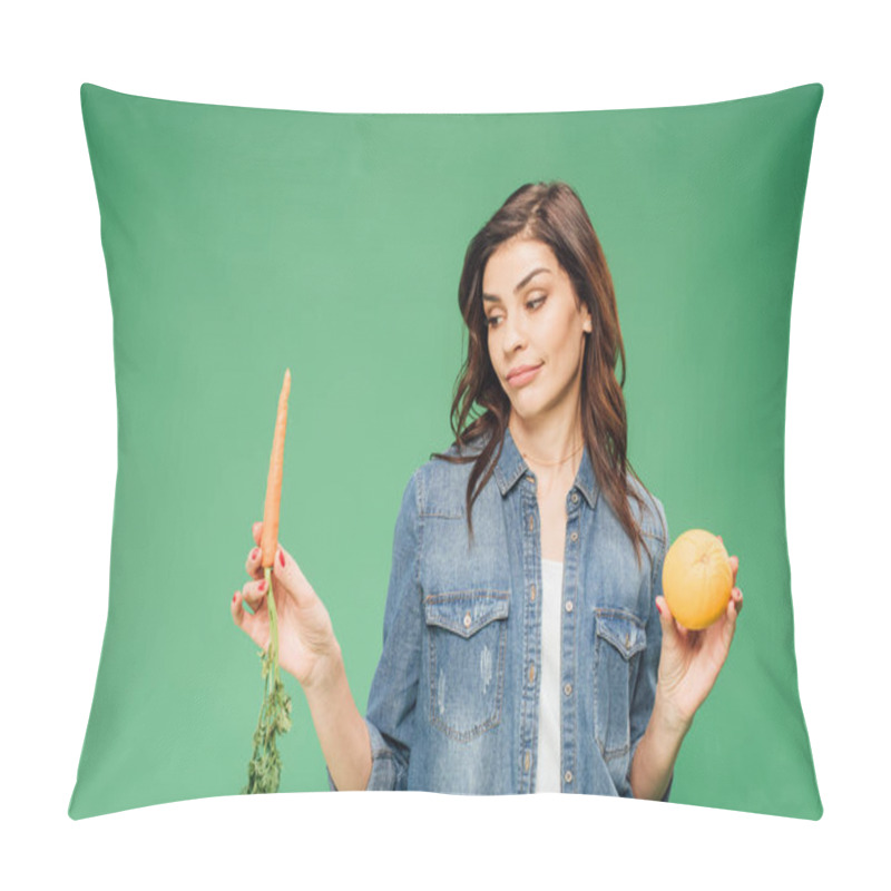 Personality  Skeptical Woman In Denim Choosing Between Orange And Carrot Isolated On Green Pillow Covers