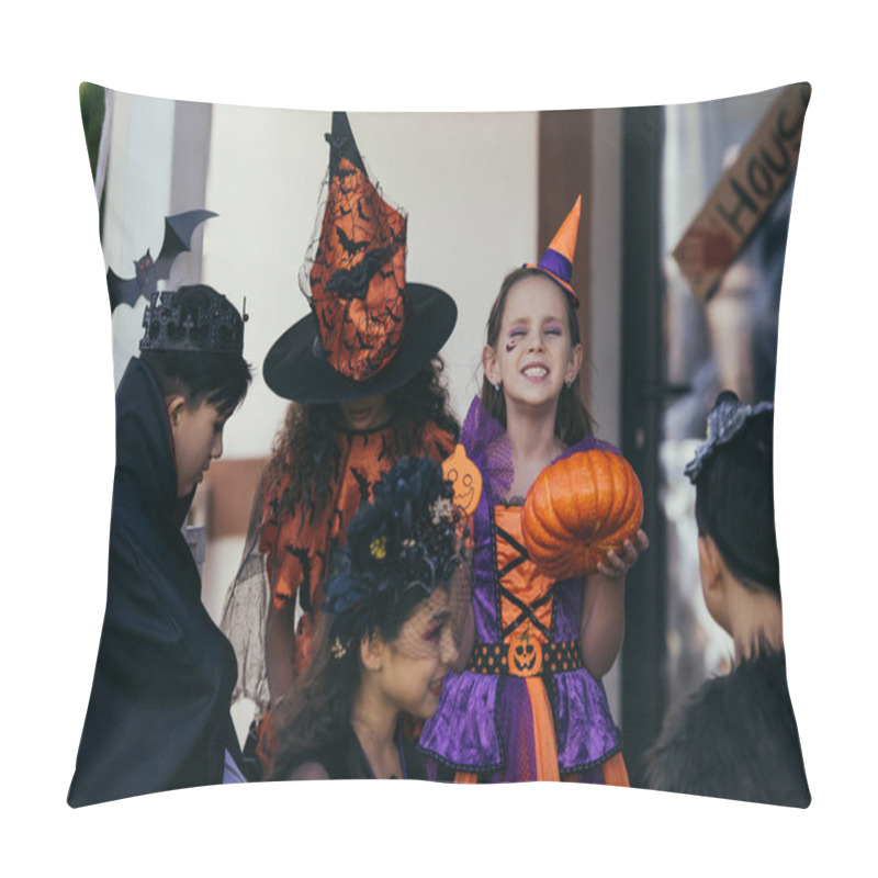 Personality  Happy Child In Halloween Costume Holding Pumpkin Near Multiethnic Friends And Decor Outdoors  Pillow Covers