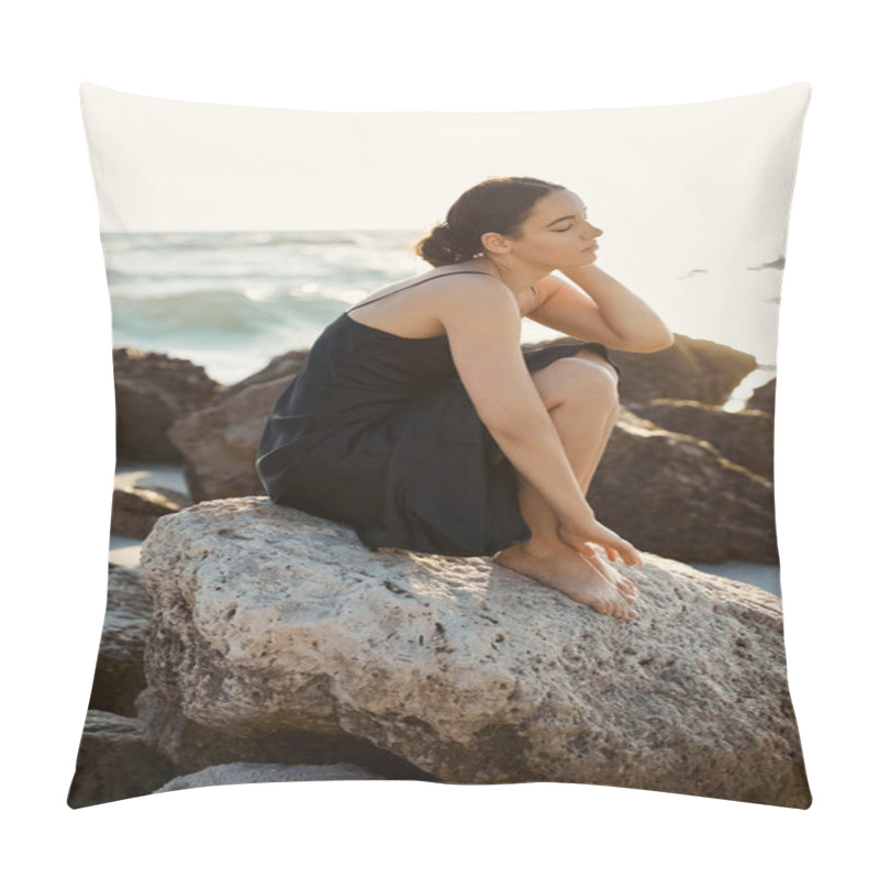 Personality  A Young Woman In A Black Sundress Sits On A Rock Near The Ocean, Her Eyes Closed In Peaceful Contemplation. Pillow Covers