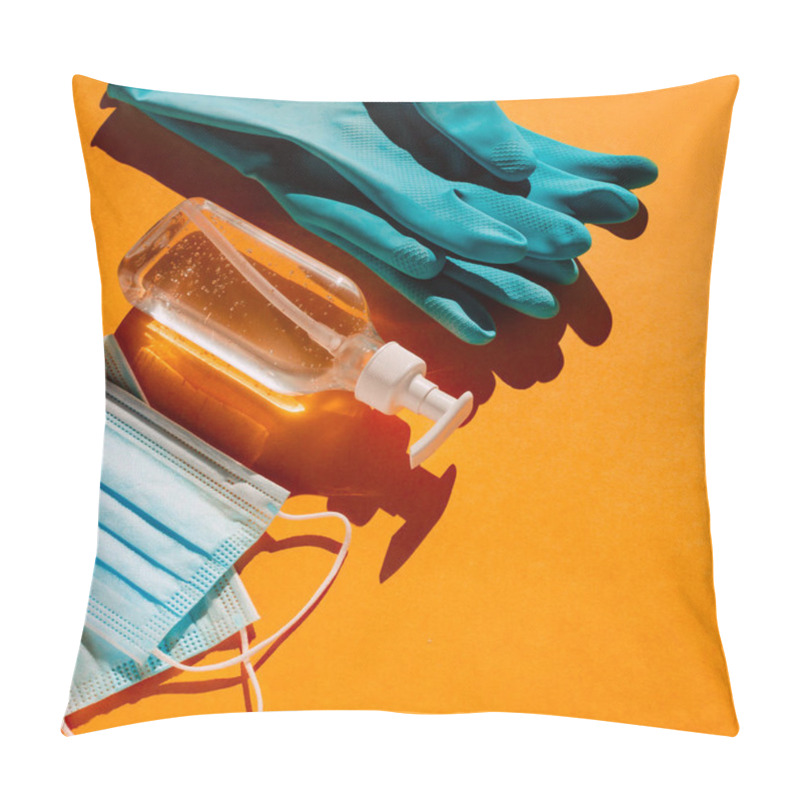 Personality  Personal Protection Kit When Leaving The House During A Coronavirus Pandemic: Individual Face Masks, Gel Sanitizer And Hand Gloves. Orange Background, Trend Light, Contrasting Shadows. Top View. Pillow Covers