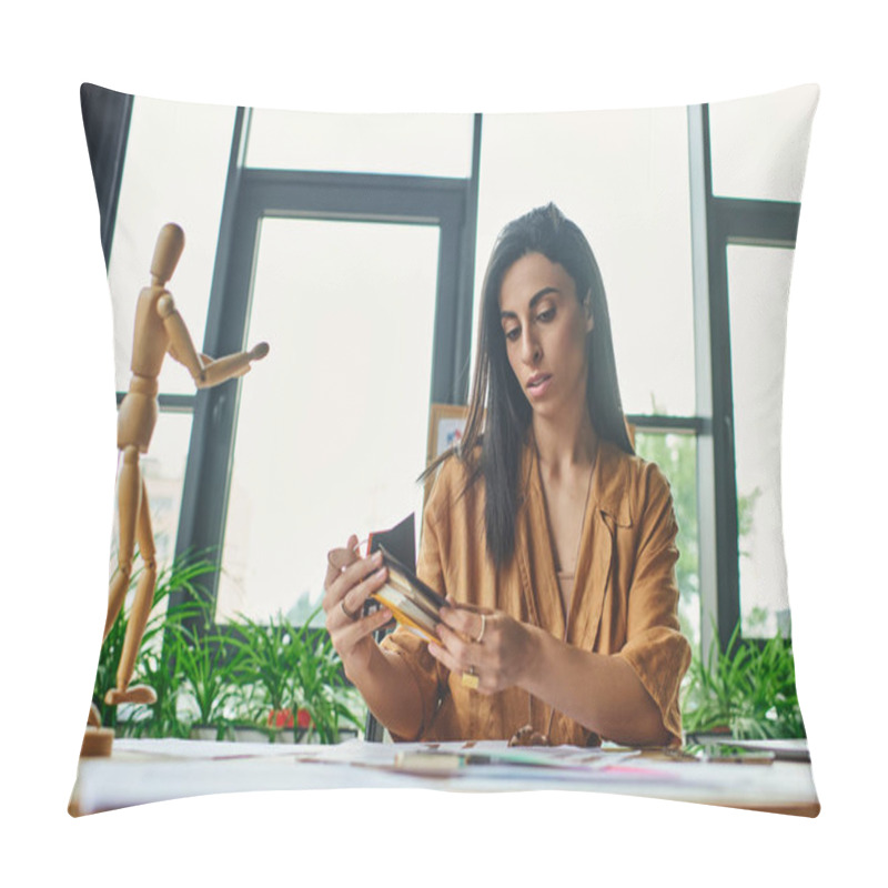 Personality  A Middle Eastern Woman In A Modern Office Thoughtfully Examines A Color Palette, Surrounded By Design Elements. Pillow Covers