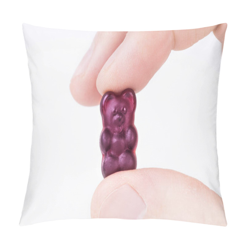 Personality  Crop View Of Male Fingers Holding A Purple Gummy Bear Against White Background. Pillow Covers