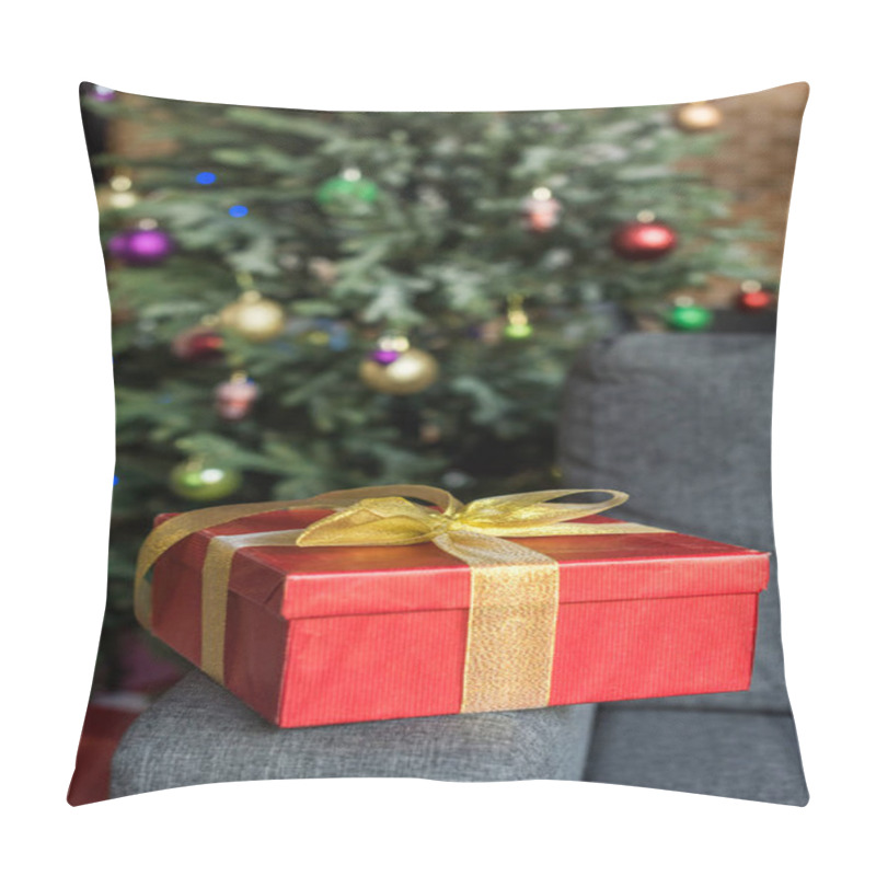 Personality  Close-up View Of Red Gift Box With Golden Bow On Couch And Decorated Christmas Tree Behind  Pillow Covers