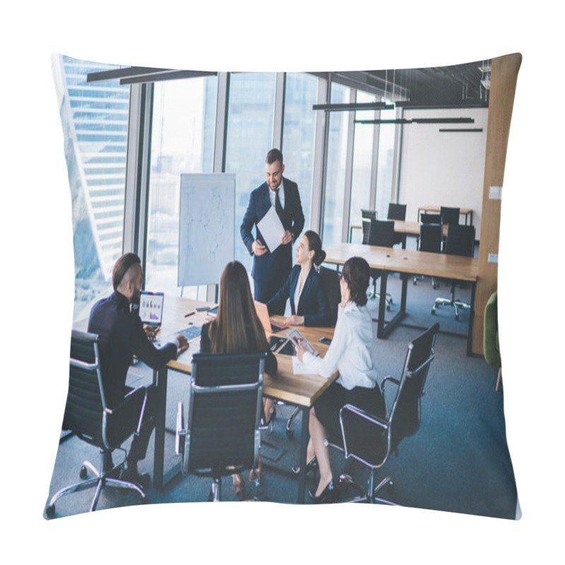 Personality  Adult Entrepreneur In Formal Wear Standing In Conference Room And Talking With Colleagues Sitting At Table While Discussing Strategies Of Company Pillow Covers