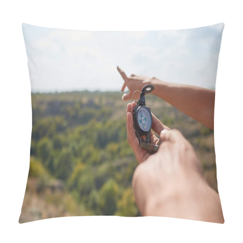 Personality  Tourists's Hands With Compass At Mountain Road At Sunset Sky. Close-up View Of Hand Showing Little Round Compass To Camera, With Incognito Man. Point Of View Shot. Pillow Covers