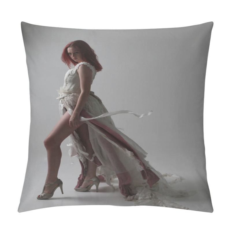 Personality  Full Length Portrait Of Red Haired Girl Wearing Torn And Tattered Wedding Dress. Standing Pose Against A Studio Background With Contrasty Shadow Lighting. Pillow Covers