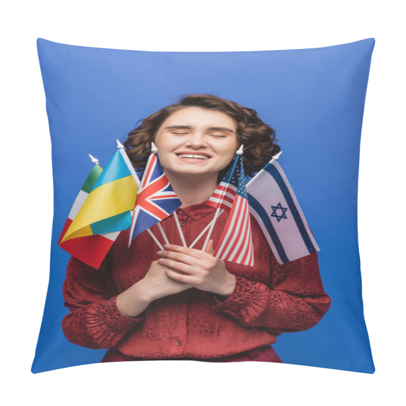 Personality  Happy Young Woman Holding International Flags And Smiling With Closed Eyes Isolated On Blue Pillow Covers