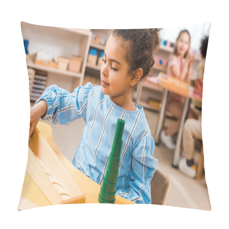 Personality  Selective Focus Of Child Playing Educational Game With Kids At Background In Montessori Class Pillow Covers