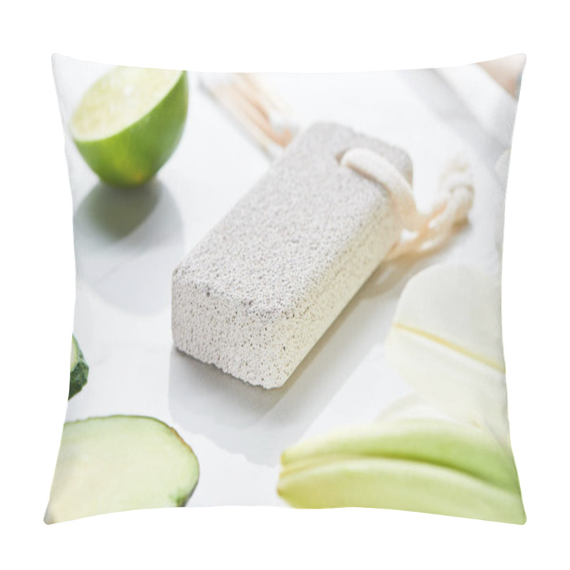 Personality  Close Up View Of Gray Pumice Stone Near Fresh Lime And Cucumber On White Surface Pillow Covers