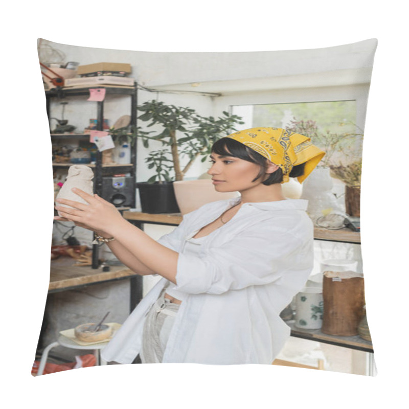 Personality  Young Brunette Asian Artist In Headscarf And Workwear Holding Clay Product While Standing In Blurred Pottery Class At Background, Pottery Studio With Artisan At Work Pillow Covers