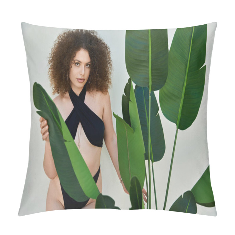 Personality  A Woman With Curly Hair Wears A Black Swimsuit And Poses Beside A Lush Tropical Plant. Pillow Covers