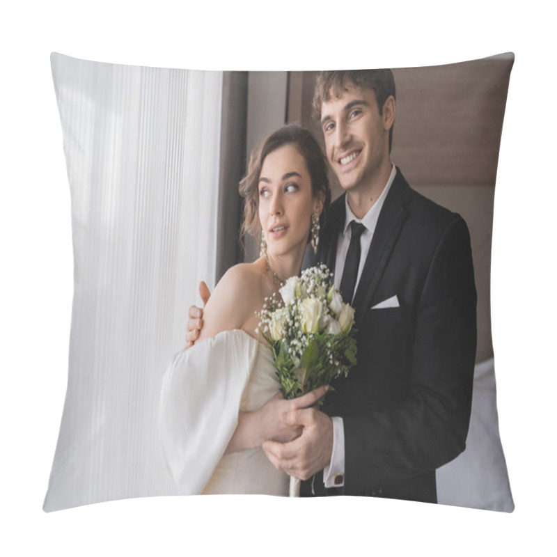 Personality  Cheerful Groom In Classic Formal Wear Hugging Elegant Bride In Jewelry, White Dress With Bridal Bouquet While Standing Together In Modern Hotel Room After Wedding Ceremony  Pillow Covers