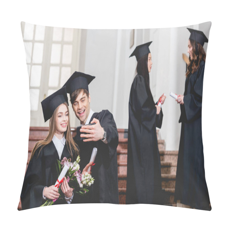 Personality  Selective Focus Of Handsome Man And Girl With Flowers Taking Selfie Near Students In Graduation Gowns  Pillow Covers