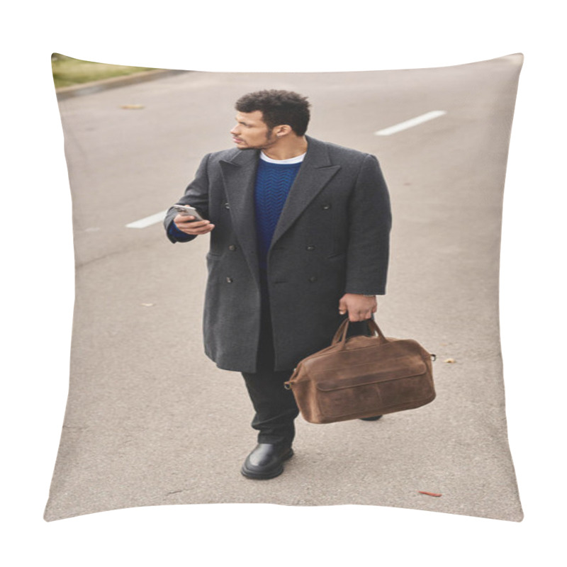 Personality  A Fashionable Man Strolls Down An Urban Road, Checking His Phone While Carrying A Leather Bag. Pillow Covers