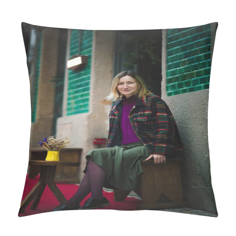 Personality  A Woman In A Skirt And A Warm Checkered Jacket Sits At A Table In An Outdoor Cafe, Enjoying The City Atmosphere In The Evening Glow. Pillow Covers