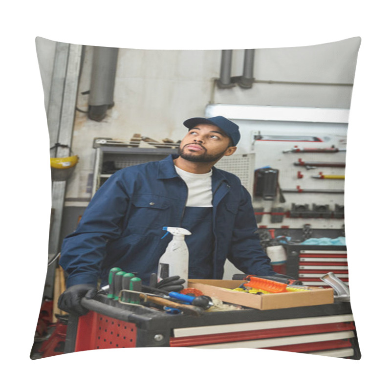 Personality  Young Mechanic Stands Thoughtfully In A Bustling Garage Filled With Tools And Equipment. Pillow Covers