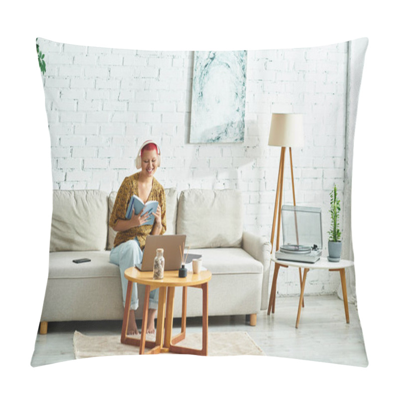 Personality  A Woman With A Radiant Smile Reads A Book While Sitting Comfortably In Her Living Room. Pillow Covers