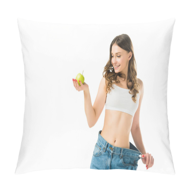 Personality  Happy Slim Young Woman In Big Jeans Holding Green Apple Isolated On White Pillow Covers