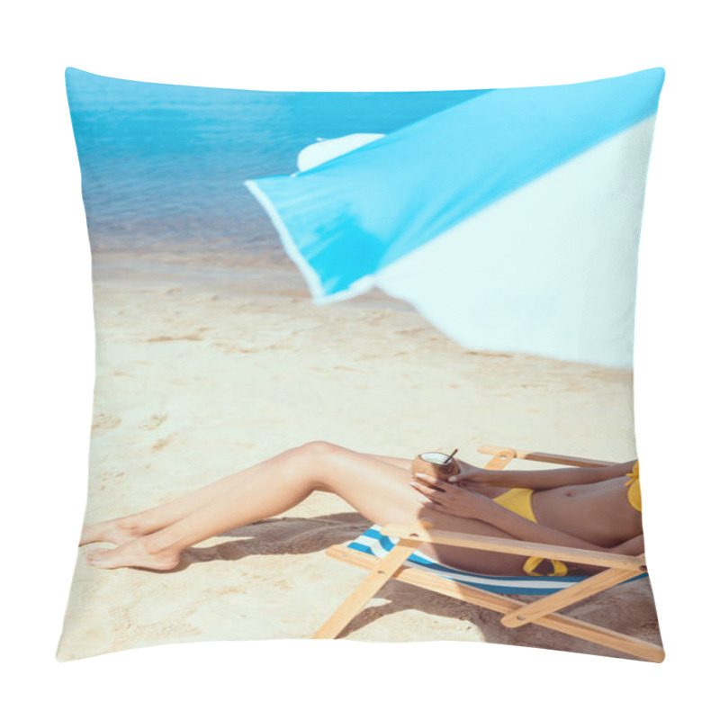 Personality  Cropped Image Of Woman In Bikini Laying On Deck Chair And Holding Cocktail In Coconut Shell Under Beach Umbrella In Front Of Sea  Pillow Covers