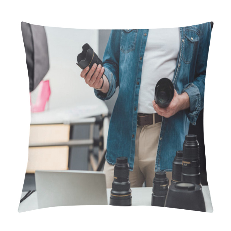 Personality  Cropped View Of Man Holding Camera Lenses In Photo Studio  Pillow Covers