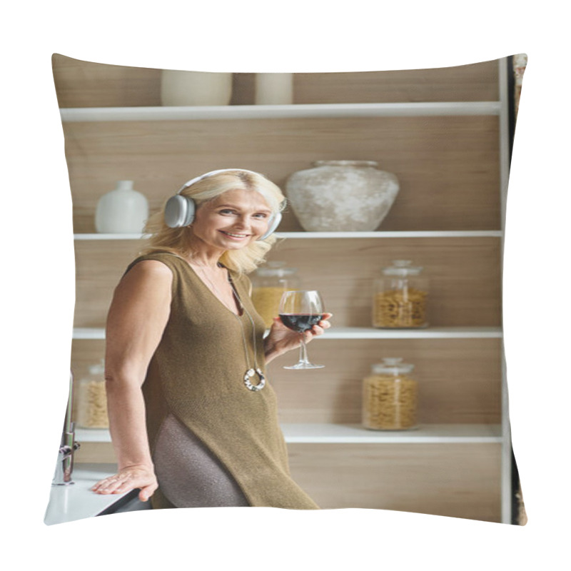 Personality  Cheerful Middle Aged Woman In Wireless Headphones Holding Glass Of Red Wine In Modern Kitchen Pillow Covers