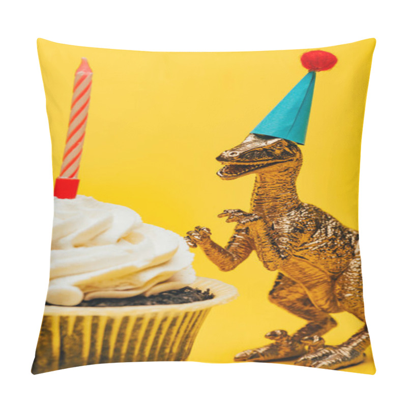 Personality  Selective Focus Of Toy Dinosaur In Party Cap Beside Cupcake With Candle On Yellow Background Pillow Covers