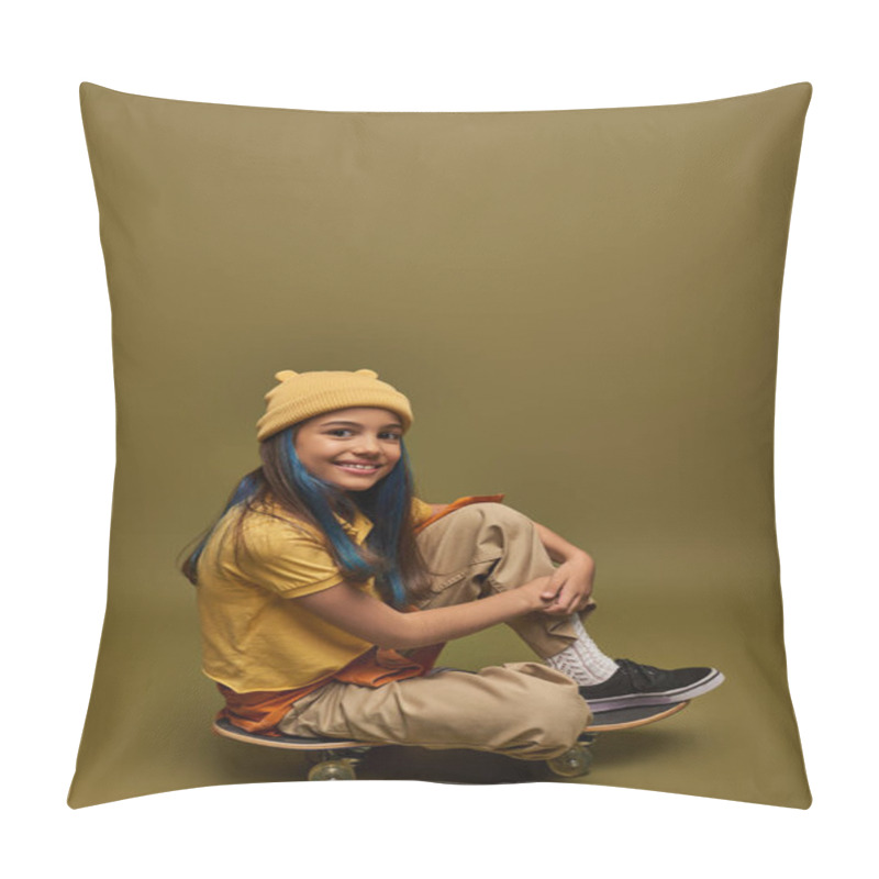 Personality  Smiling Preteen And Stylish Child With Dyed Hair Wearing Urban Outfit And Hat Looking At Camera While Sitting On Skateboard On Khaki Background, Girl With Cool Street Style Look Pillow Covers