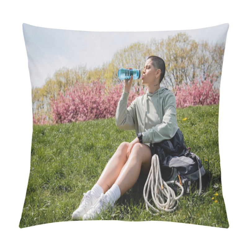 Personality  Young Short Haired And Tattooed Female Backpacker With Smartwatch Drinking Water While Sitting Near Backpack On Grassy Lawn With Nature At Background, Trailblazing Through Scenic Landscape Pillow Covers