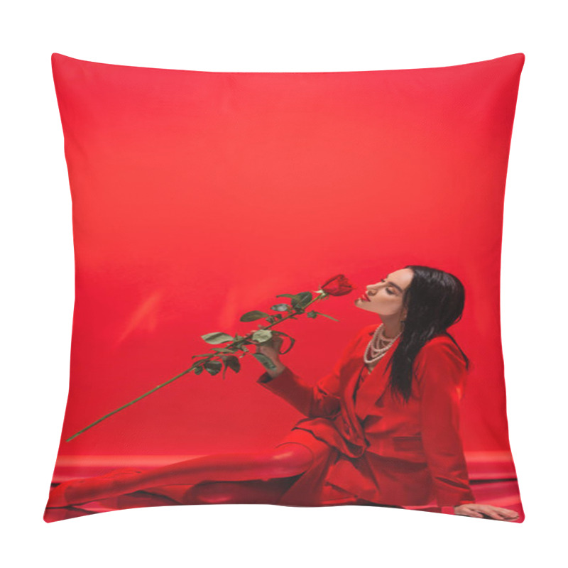 Personality  Pretty Brunette Woman In Jacket Smelling Rose While Sitting On Red Background  Pillow Covers