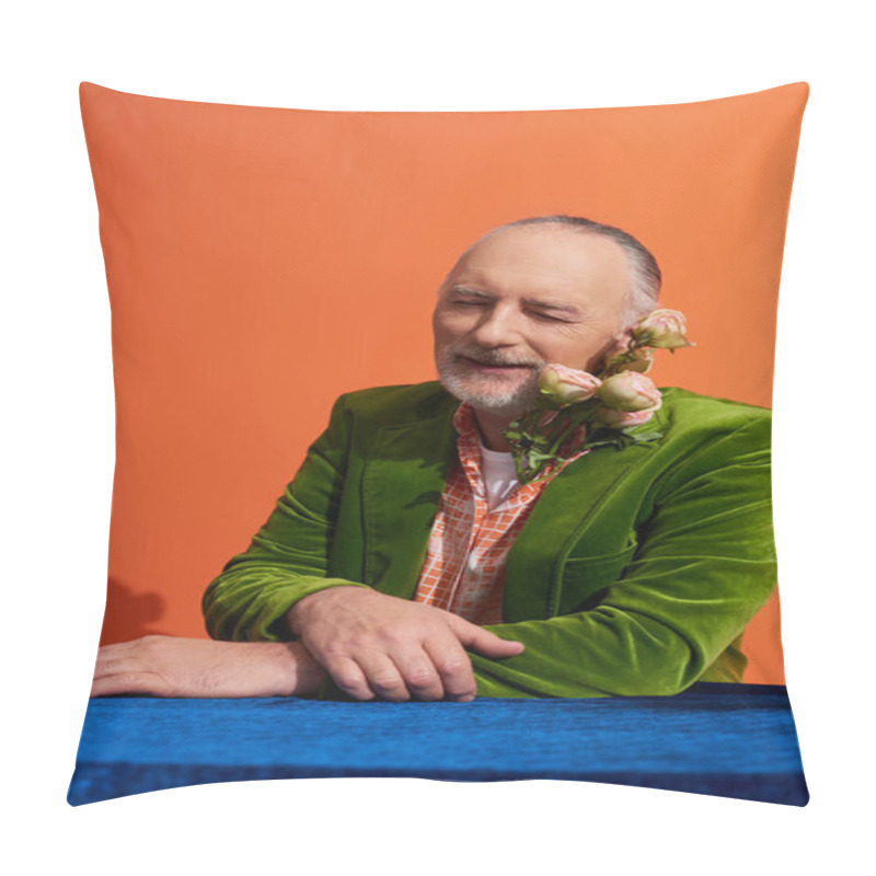 Personality  Pleased Aged Man Smiling With Closed Eyes While Sitting With Fresh Roses Near Table With Blue Velour Cloth On Vibrant Orange Background, Green Velvet Blazer, Person Style, Happy Aging Concept Pillow Covers