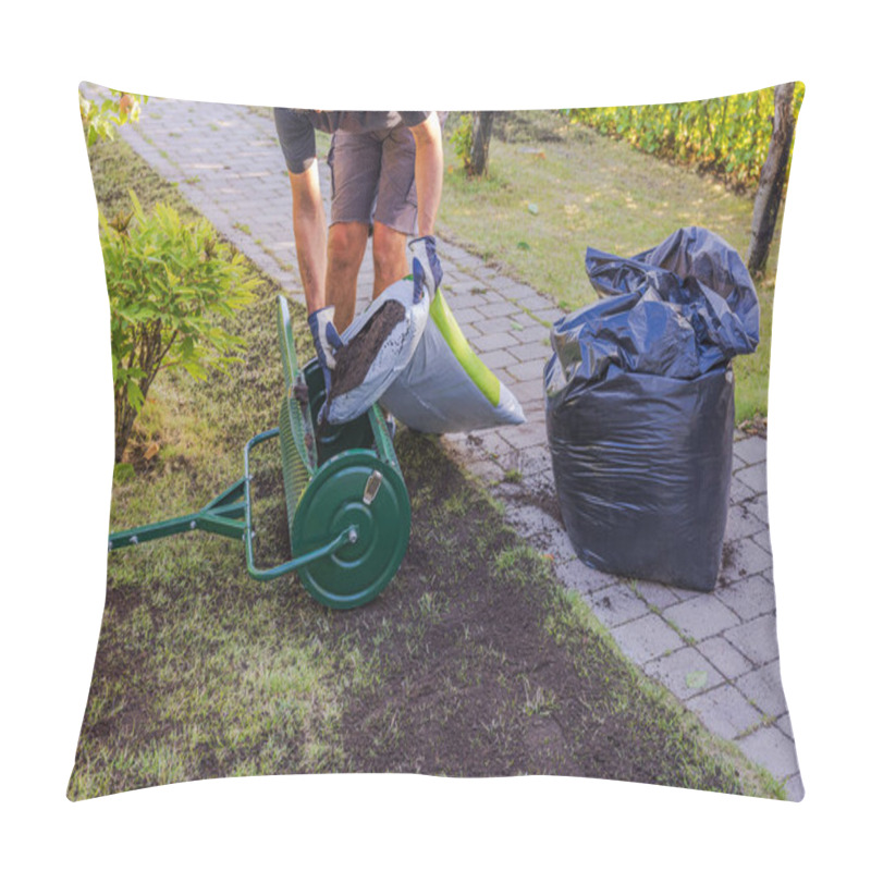 Personality  Man Filling Lawn Top Dresser With Soil For Grass Restoration In Garden. Sweden. Pillow Covers